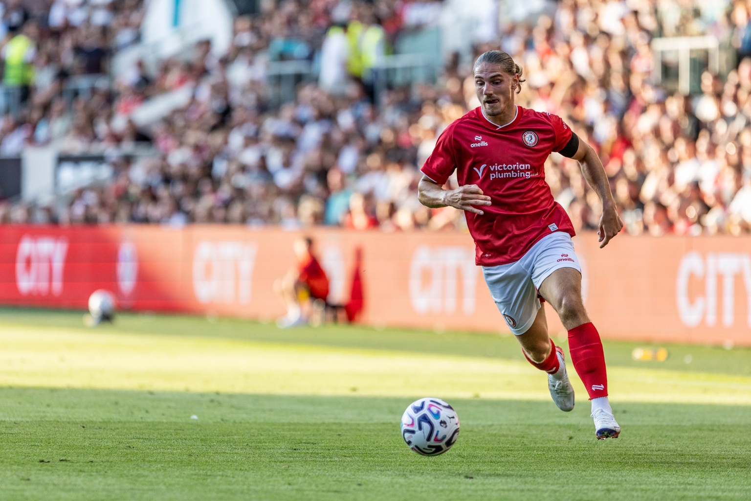 Football player running with the ball