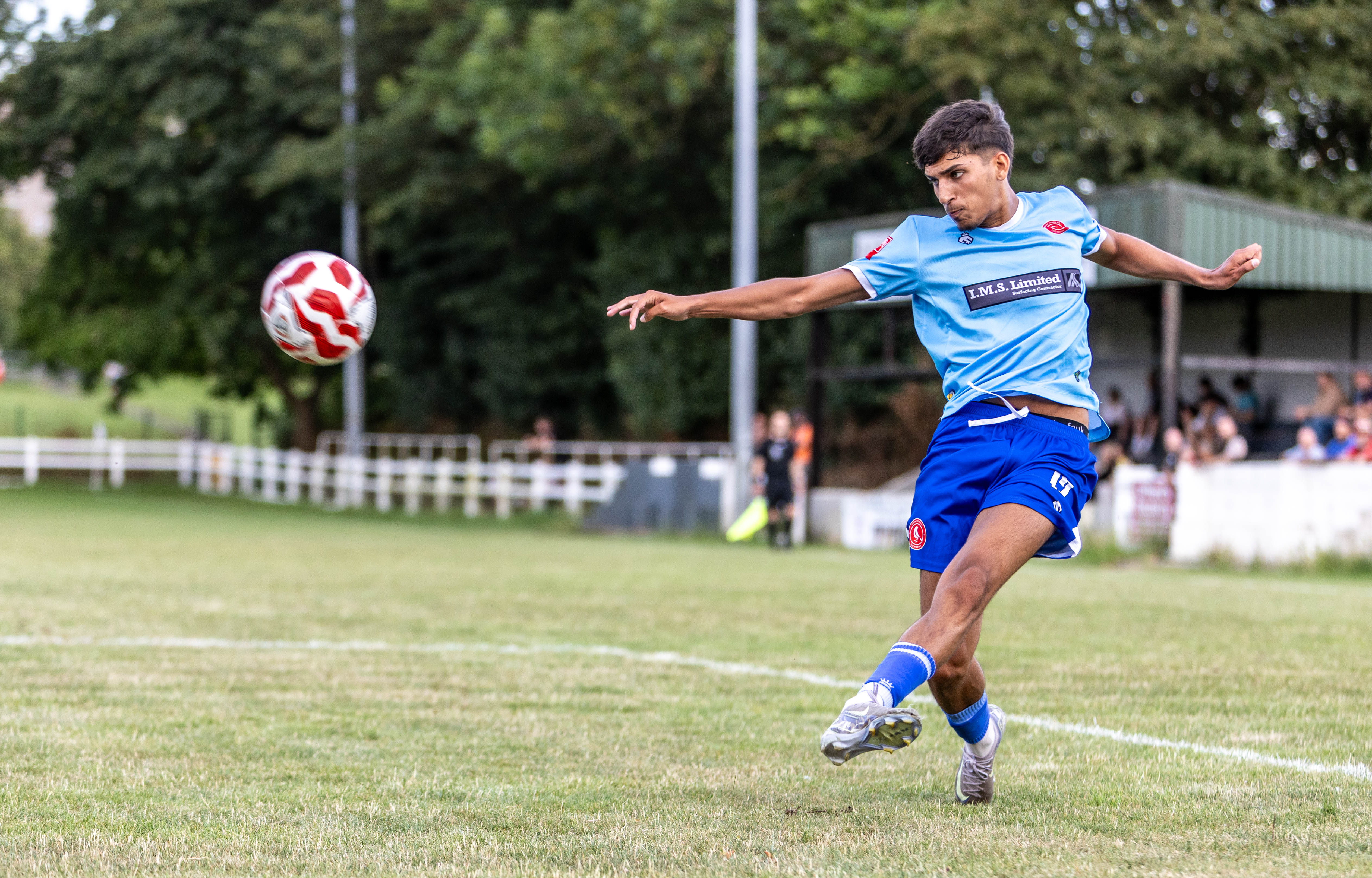 Footballer striking the ball