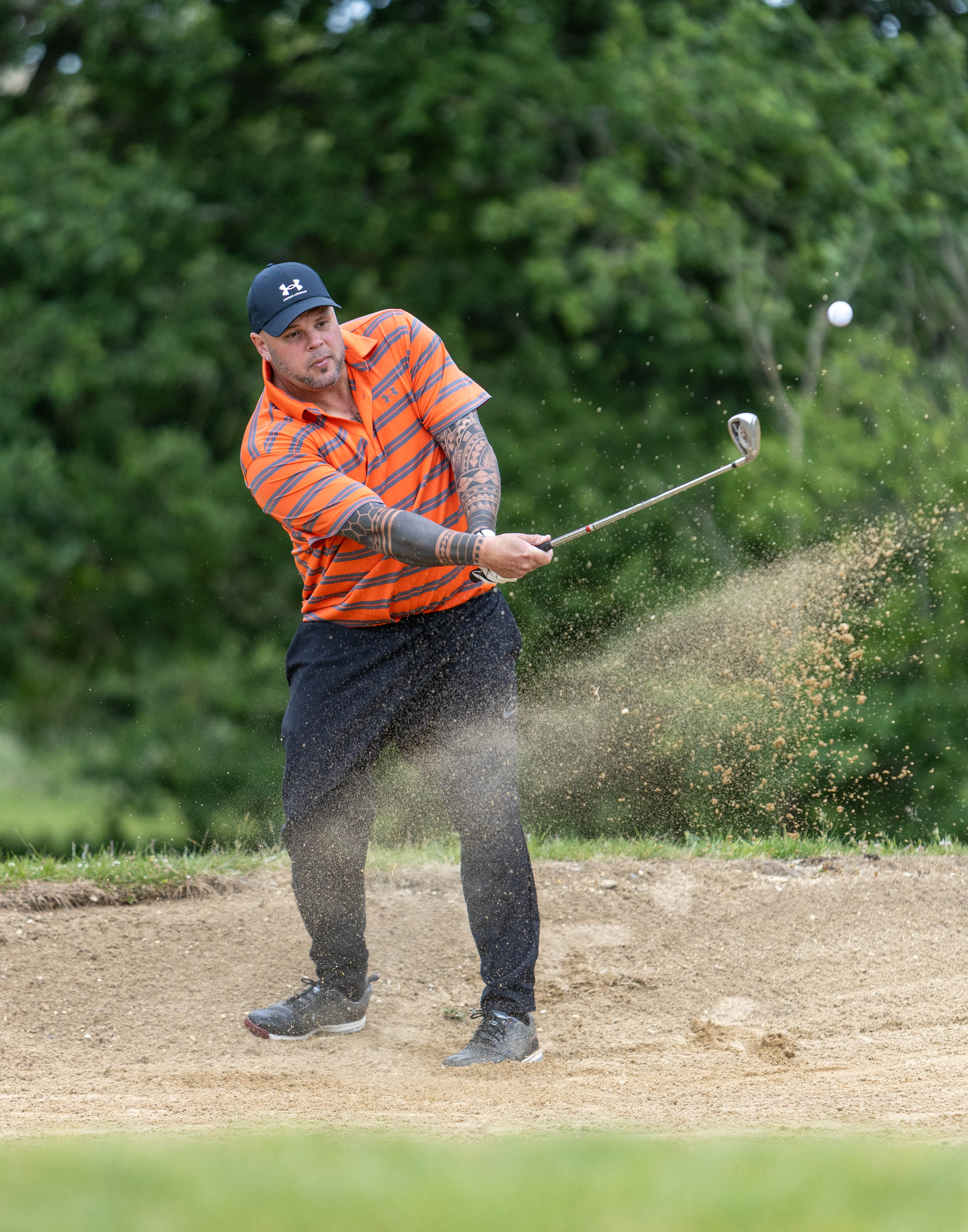 Golfer playing a bunker shot