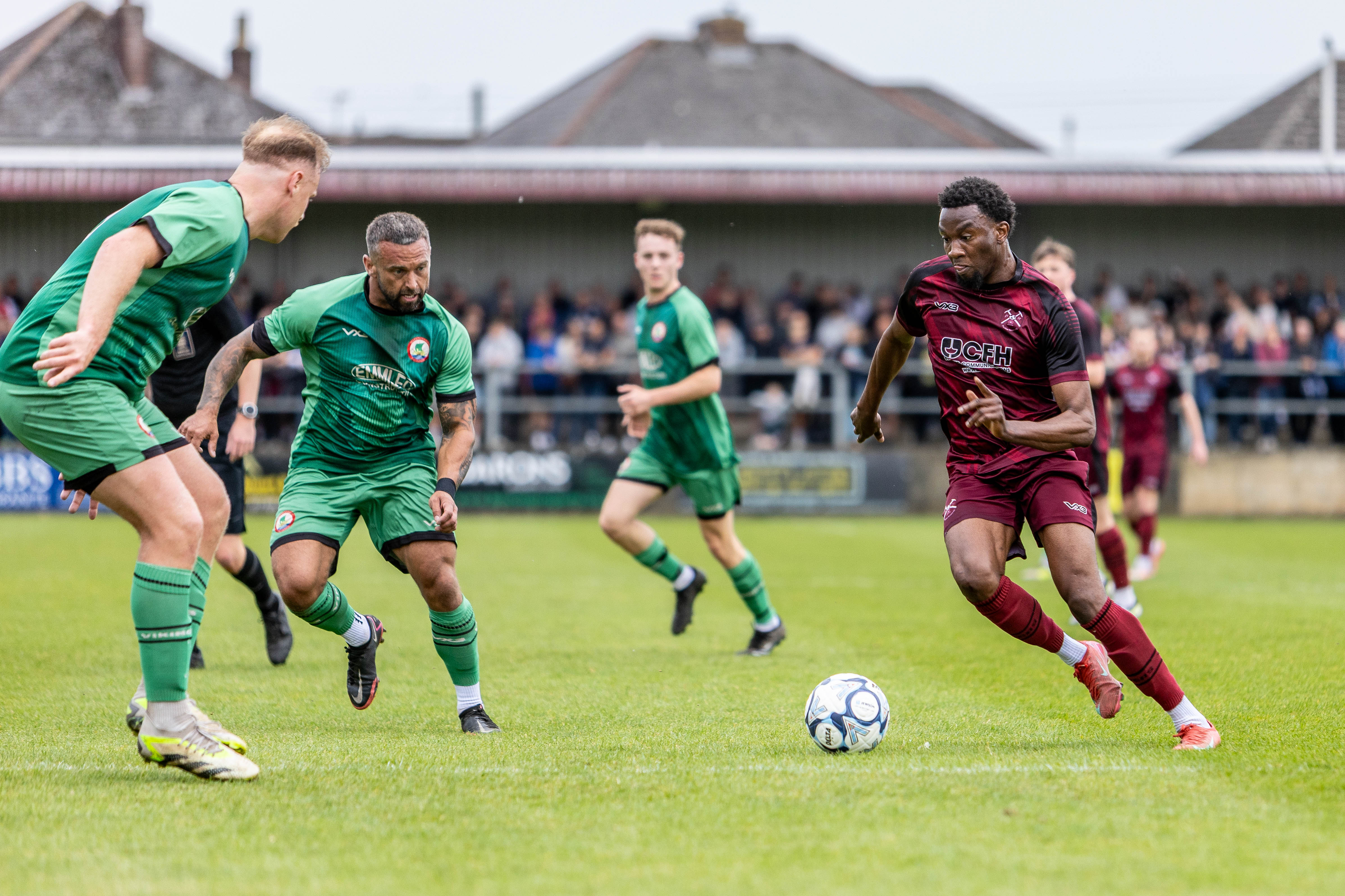 Footballer breaking forward with the ball